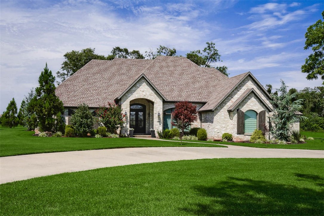 Located minutes from Downtown Bentonville this custom-built estate home offers a more private sanctuary setting from the city rush. All one-level with a master bedroom suite that must be seen + safe room, bonus/media room. All bedrooms are suites with their own private baths and walk-in closets. Enjoy MANY high-end features: lighting, Control 4 System, hand scraped hardwood flooring, designer finishes, custom drapery, impressive cabinetry and trim throughout, cathedral ceilings, cast stone fireplace and expansive windows that flood the home with natural lighting. Outside and on nearly two irrigated acres; oversized 3 car garage with epoxy flooring, circle drive, covered patio with outdoor living and wood-burning fireplace + kitchen that opens to a yard and just beyond an amazing 52x36 Barn/Shop with RV storage. Barn is custom built, insulated and equipped with electric and access to water supply. This combination of thoughtful design and quality construction make this a one-of-a-kind home you won't want to miss.