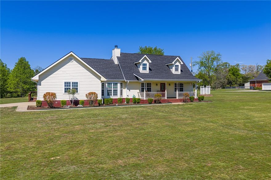 Located in River Valley Estates in Ozark, this custom-built two-story home sits on approximately 3 acres & offers a lifestyle of space, comfort, & everyday ease. With only two owners, this 4-bedroom, 3.5-bath property reflects thoughtful design throughout. The main living area centers around a wood-burning fireplace, creating a natural gathering space, while a dedicated office or hobby room offers flexibility for work or quiet retreat. A screened-in porch invites you to slow down & enjoy the surrounding views year-round.  The kitchen features oak cabinetry, trim, & doors for a consistent, timeless feel. A geothermal HVAC system adds energy efficiency & comfort in every season. The primary suite is on the main floor with a full ensuite, & the closet also functions as a safe room.
Outside, the acreage offers room to spread out. A shop adds versatility for projects or storage, and the above-ground pool with composite decking creates a low-maintenance space for relaxing & loving where you live.