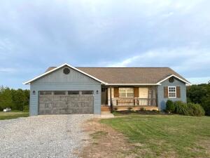 Recently remodeled 3 BR/2Bath home on almost 35 acres! Seller has added oak hardwood floors on the main floor, a new dishwasher and a GE Cafe Gas Chef Stove in the kitchen (which features quartz countertops). The basement is partially finished and plumbed for a bathroom and extra laundry. Possibilities include an extra bedroom and TV/Family room. A vent- free fireplace is installed and ready to enjoy. A two car garage, concrete patio and a deck with a breath-taking view round off the perfect place for you to call home. Bergman Schools.