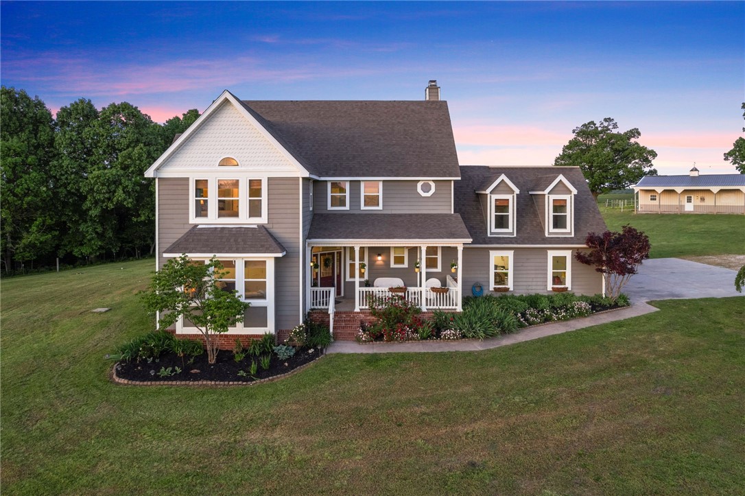 Experience the breathtaking landscape of over 21 pristine acres offering a 1,440 sqft 3 stall barn (w/
individual paddocks) w/ tack room, & pull through hay storage; 15x21 Lean-to w/ 100 hay bale storage;
private pond stocked with Bass, Catfish, & Bluegill; Spacious Outdoor Plumbed Kitchen fully equipped to
host any outdoor event featuring a large gas grill, restaurant style vent-hood, SS refrigerator, built-in
waste bin drawer, wired for sound, A/V receiver, outdoor TV, hot tub, TrexĀ® Decking, pergola, & a custom
concrete fire pit. Step inside this oasis offering 3 beds, 2.2 baths, & a Large Bonus Room, solid oak
flooring, tons of natural light, & views for days! Recently updated kitchen w/ stunning Quartzite, clear
view cabinetry, built-in wine rack, & more! Make your way up the custom staircase to explore the sizable
primary suite w/ gas fireplace, deep soaking tub, & private office. Hardwired 14.5kw whole house
Generac Generator, 6 person in-ground steel storm shelter & New Roof 5/25!