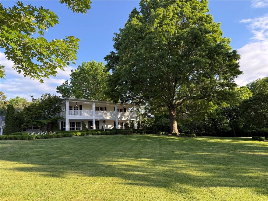 Centrally located in the heart of Fayetteville on 1.63 acres. Enjoy a serene setting overlooking mature trees and an English garden from a two-story sunporch.
The house is predominantly positioned on a sprawling lot within an established neighborhood.
Elmwood Drive is a direct connection to the Razorback Greenway trail system which gives you the added convenience of walking or biking to parks, schools and downtown Fayetteville.
Easily access I-49 and the University of Arkansas.