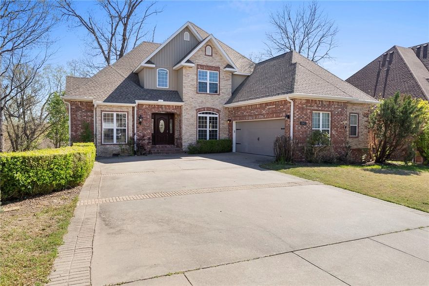 *Up to $3,500 preferred lender credit* Ideally located minutes from everything downtown Bentonville has to offer—Crystal Bridges, 8th Street Market, trails, & easy highway access—this beautiful home blends charm & functionality. Inside, the spacious kitchen features hardwood floors, granite countertops, & a cozy fireplace in the breakfast nook. Primary bath includes a clawfoot soaking tub, dual vanities, walk-in closet. The fully finished walk-out basement offers flexibility, complete with a large family room, kitchenette, bedroom, full bath, and office—perfect for a private guest suite or mother-in-law quarters. You’ll also appreciate extra storage under the stairs & a workshop with private entrance. Upstairs, 2 additional bedrooms, each with en-suite bathrooms, plus a versatile hobby room. Don't miss the expansive attic—ideal for finishing into a bonus room or additional storage. Raised deck perfect for entertaining, or relax on the covered patio below, easily accessed from the walkout basement. Roof 2024.