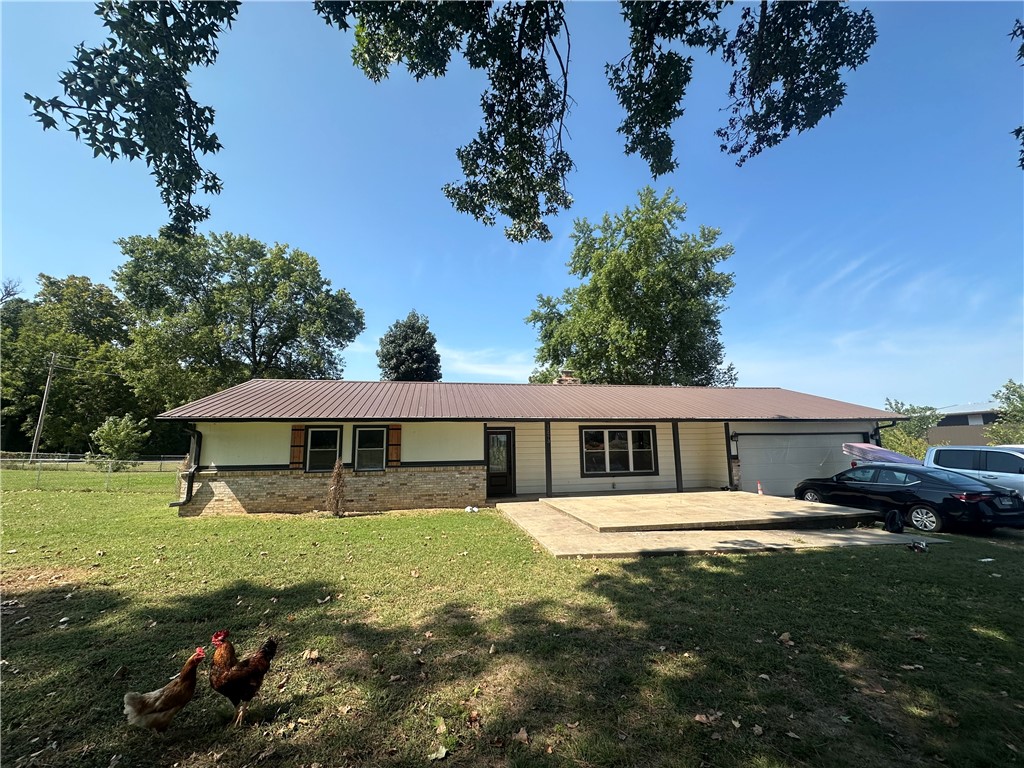 This house sits on a corner lot, surrounded by a beautiful acre of land. Inside this lovely one-story home, you'll find plenty of updates, including new bathrooms, flooring, siding, paint, garage doors, windows, sliding doors, and trim. The home also has a bonus room that could easily be turned into a fourth bedroom, guest room, office, or game room. Enjoy a peaceful morning coffee in the sunroom, taking in the natural scenic view of your backyard or your front yard patio. Plus, the house features a finished basement for extra space or shelter.