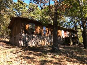 2 wooded acres with a pond. House needs repairs from top to bottom. Buyer needs to inspect as desired. Was built per Farmers Home Specs originally in 1987-88. Will not qualify for 2ndary market loans as is. Concrete parking pad. Master bath has room to add shower or tub but was not allowed per FMHA specs in the 80's.