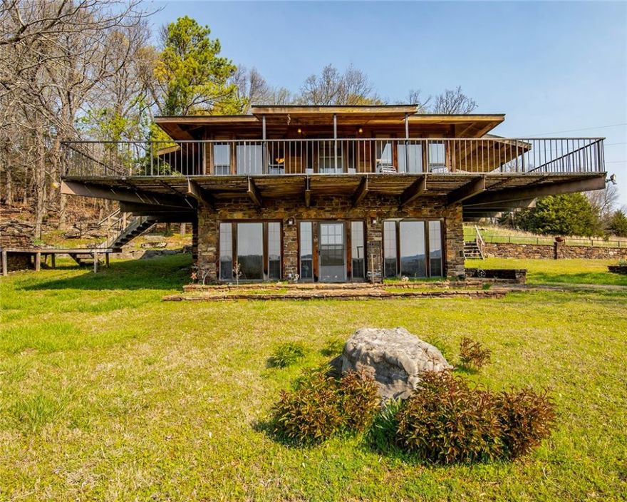 Absolute paradise awaits with this property! Privacy and seclusion within minutes of Fayetteville!  The 70 acres is mostly cleared with a wooded perimeter.  The home is in very good condition with lots of extras including a walkout basement with a TREMENDOUS view!  The downstairs walls are 8-inch heavily reinforced sealed concrete.  Wonderful family room downstairs with a wood burning fireplace.  This land is prime time for development or for creating your own family estate! Plenty of wildlife to admire, too! Can only view with appointment only