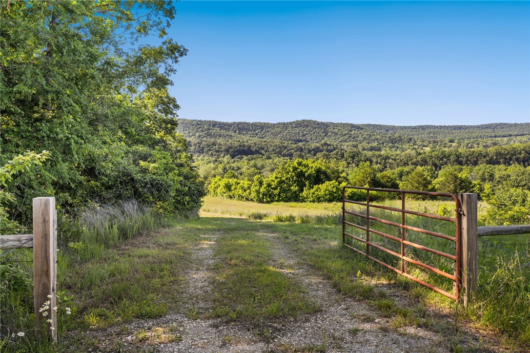 Dreaming of your own place in paradise? Located at Trigger Gap of the Kings River Valley this stunning piece of land is on the market for the first time in a decade. Located 15 minutes from Eureka Springs, and on the Arkansas High Country Route, this property offers the very best of the adventure lands of Arkansas' Ozark Uplift. With two easements to the river, acres of glade topography, and an unprecedented forever-view overlooking The Nature Conservancy's Kings River Preserve, the property is perfect for fishing, floating, gravel cycling, and unwinding by the Kings River. Whether you are building a dream home or a weekend high end camping retreat, this one is a rare find. Peaceful and private with both gravel and paved access via Highway 221, and a 640' high output water well drilled to the Roubidoux.