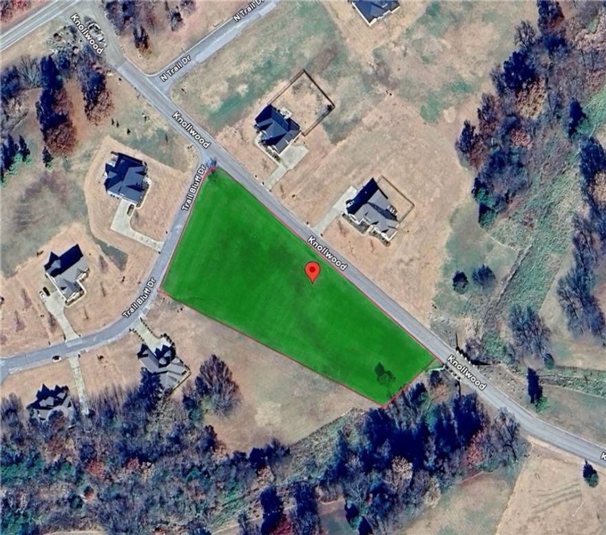 Discover the perfect setting for your new home with this prime 2.27-acre lot in The Knolls Subdivision. Located on Fayetteville's beautiful East Side, this desirable property offers the best of both worlds: a spacious, open canvas for construction and incredible lifestyle amenities. Residents enjoy a pool, four new pickleball courts, a tennis court, a clubhouse, and miles of walking trails. All essential utilities are available at the street, including public water, natural gas, underground electricity, and high-speed internet. Plus, you’re just a short 10–15 minute commute to Fayetteville and the University of Arkansas. Zoned for Vandergriff Elementary and McNair Middle School, don't miss out on this opportunity in a highly sought-after neighborhood!