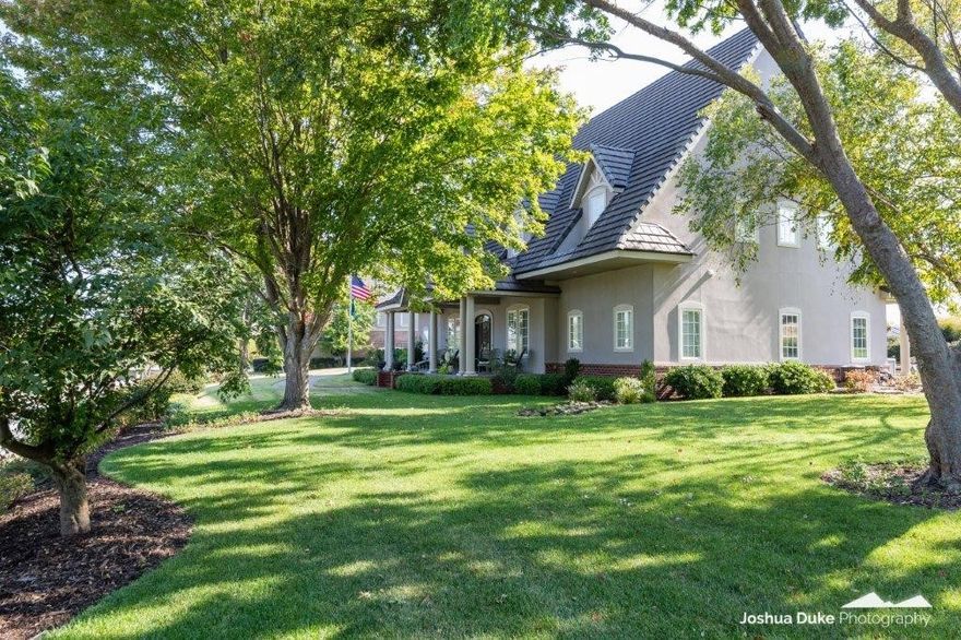 Timeless custom-built 5120 sqft Pinnacle Country Club estate situated on a spacious .67 acres w/commanding views of the golf course & the best sunsets in NWA! A welcoming front porch greets you as you enter the 2-story foyer that introduces the Study, Dining & open Great Room; real wood flooring & welcoming natural light! Large, fully equipped Chef’s kitchen w/granite countertops, a grand center island, double ovens, gas range, wine fridge, 2 pantries. Thoughtful custom touches such as oversized laundry, extra mud room, interior tornado shelter built into powder bathroom; also ideal location for a future pool bathroom!