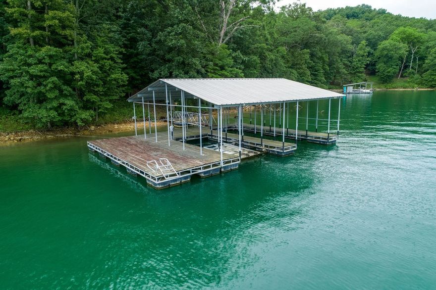 This stunning 1.82 acres offers 341.52' of LAKE FRONTAGE. Situated in "Hoot Owl Hollow" just off of Indian Creek on the beautiful north end of the lake. Fantastic building site on this gorgeous property with water views , and surrounded by beautiful Magnolia and Hardwood trees. Gentle walk to Private 2 Slip Dock with Swim Deck: 1 slip 12'x32' with 4' header, 2nd slip 12'x26' with 10' header, and swim deck 12'x36'. Easy to show with paved road right to the property. You can walk through the gate at the directional sign to the dock.  Schedule youāre showing today!