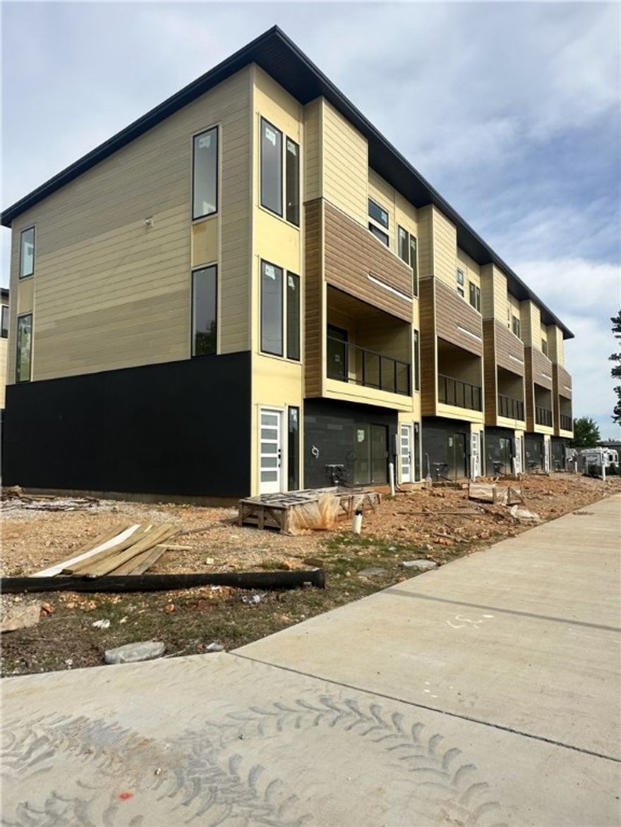 Modern living located across the street from Airship Coffee! Situated near the Crystal Bridges trail and the downtown square, this brand new condo offers both convenience and contemporary design. The property includes an attached 2-car garage and a community bike wash station, perfect for outdoor enthusiasts. Additional neighborhood amenities feature an outdoor grill and a fire pit, ideal for social gatherings. The contemporary kitchen is a highlight, featuring European cabinetry, exquisite quartz countertops, and a waterfall island. With modern fixtures and high-end finishes throughout, this condo exemplifies quality. Enjoy the elegance of glass balconies and the comfort of 3 luxurious bedrooms. This condo also includes 3.5 baths, designed with style and functionality in mind. Experience the ultimate luxury lifestye with this exceptional property. Additional units are available.