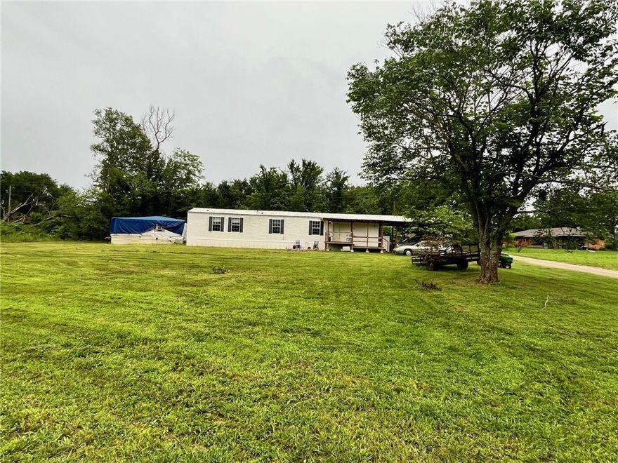 Built in 2007, this 2-bedroom, 2-bath home sits on a peaceful 0.64-acre lot just minutes from Blue Mountain Lake and public hunting land. Mount Magazine can be seen from the road and even from the front porch—offering a beautiful view in every season. The home offers a simple, functional layout with two full bathrooms and plenty of cabinet space. A few flower beds have been started, but with this much yard, there’s room to create a garden, outdoor hangout, or just enjoy the open space. Whether you're looking for a weekend escape, a hunting or fishing retreat, a rental property, or a place to slow down and live the quiet country life—this one offers all of that and more. More pictures to come!