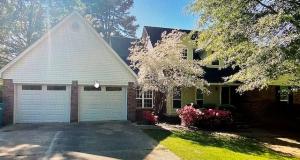 You can't get any closer to new than this beautiful remodel just a stone's throw from the lake. Situated on a large lot on a charming circle drive this location is hard to beat. The list of new goes on and on including roof, some windows, garage doors, flooring, paint, light fixtures, appliances, granite, an much more! 4 BR 3BA and two living areas are yours at this location. Schedule your showing today!