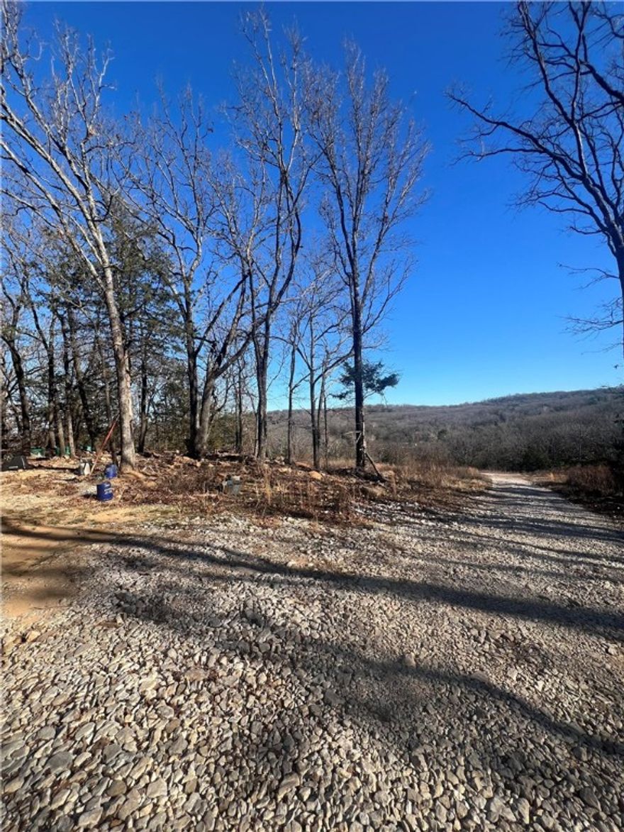 Looking for a secluded feeling with a view, but not in the middle nowhere? This property is for you! sitting on 3.7 acres is a beautiful 3 bedroom 2 bathroom Clayton Homes manufactured home just under 1200 sqft with an open kitchen/living room concept and split floor plan this home feel open and spacious with so much natural light. Tiny Home on the property is not included in this listing but can be purchased separately.