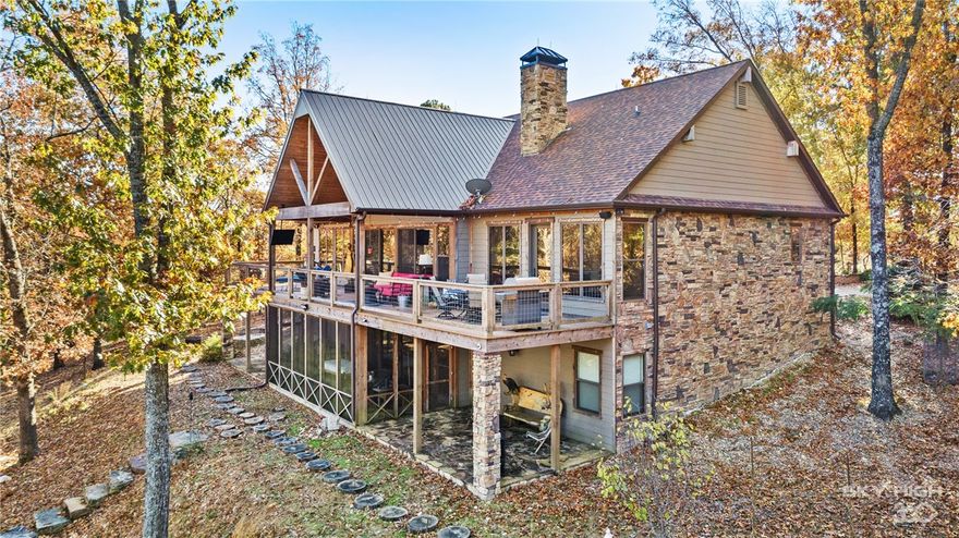 Welcome to an Ozark Mountain Paradise and a true luxury estate. Soak in the Million dollar views of Beaver Lake appearing from the deck of this custom 5,300 sq ft Celtic Construction built home. The sprawling 40 acre wooded estate boasts a new private 2-stall covered boat dock with electric lifts and swim dock. This property claims a half mile of Beaver Lake shoreline. Enjoy being at the lake in the rustic private fishing cabin with covered and screened porch, just steps away from the dock. The Rocky Top Estate grand centerpiece is the gorgeous custom home showing an elegance & artistic design with one of a kind custom features. Entertain friends & family in this country setting with modern design to create a welcome feel. Don’t miss the comfort of the media room, the amazing wine cellar, apartment above the garage, the exercise room and game room area.
*See amenities-list for more features!