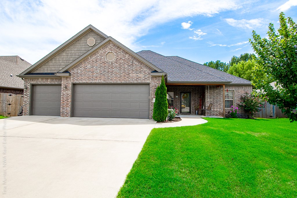 Welcome to Camden Way located just 6 miles from the new WalMart campus! Thoughtful upgrades of this custom built home include gas cooktop, built-in oven & microwave, custom cabinets, walk-in pantry & wood look tile. The spacious master suite has a must see closet with built-in workspace connecting directly to the utility. Enjoy gathering on the extended back patio & playing a game of horseshoes in the inviting backyard. 10x12 Storage shed on concrete pad is equipped with electricity. Call to see today!