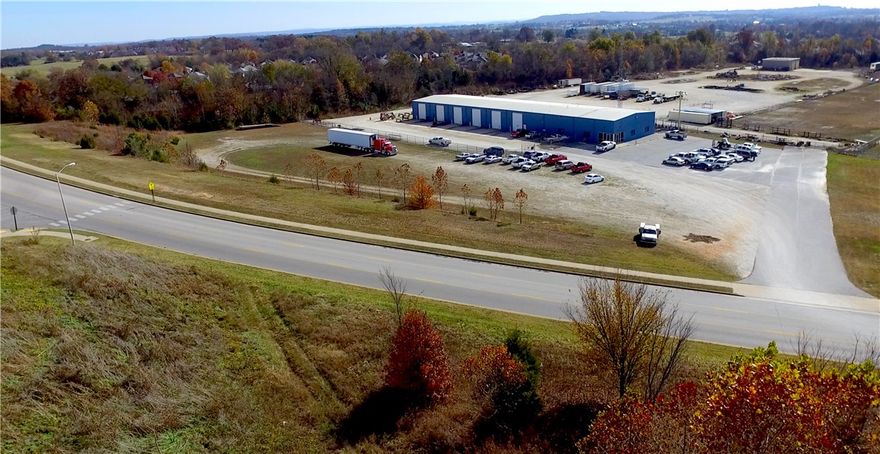 Industrial equipment service facility with 14,400 sq ft building which is divided in 5,100 sq ft of office space & 9,300 sq ft of shop area. The office area is divided into offices, conference rm, reception, break, 2 restrooms & a utility room. The shop area has 6 truck service bays. On the rear of the property is a 2,116 square foot wash bldg w/ 2 wash bays. The site is nearly 14 ac w/ approximately 20,000 sq ft of asphalt, 10.0 acres of gravel parking, a radio tower, a light tower, & chain link fence.