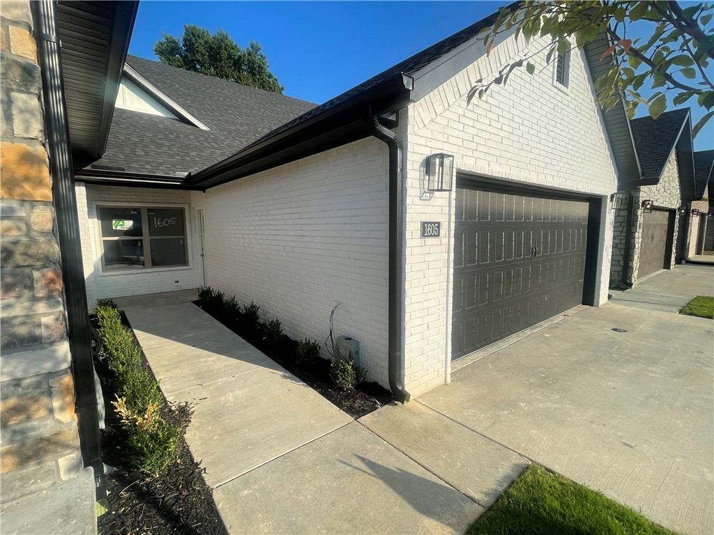 Brand New Townhomes in a great location close to Pinnacle Promenade Mall, Razorback Greenway Trails, Restaurants, Business Districts and I49. All one level 2 bed 2 bath with 2 car garage. Open floor plan w/ gas log fireplace, LVP floors, granite counter tops, eat-in kitchen, pendant lighting, SS Appliances - Gas or Electric Ranges, pantry, tiled showers and walk-in showers. Private covered patio landscaped front yards. Low maintenance and easy living in NWA. Buyers can pick out colors and selections within builder's allowance. Photos are samples -colors and selections may vary. Taxes are estimated.