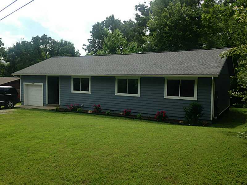 Total Remodel Completed in 2015. New paint inside and out, new flooring throughout, carpet, ceramic tile, laminate, granite counters. New garage door opener, door and steps to garage. New Stove, vent hood, light fixtures, dishwasher and landscaping!,Great little home in a quiet, established neighborhood 100% Financing Available Through RD Loan