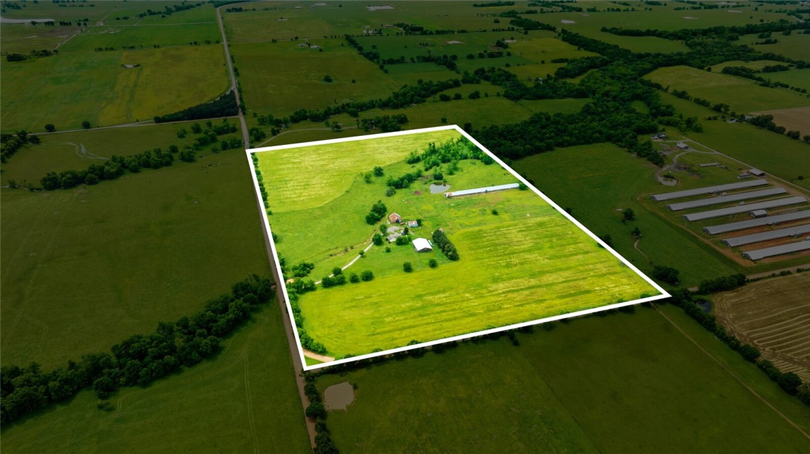 IF YOU DREAM ABOUT FARM LIFE - HERE IS THE PERFECT OPPORTUNITY! Welcome to paradise in Gravette, AR, 60 ac mol with a concrete pad/shop, outbuildings, old chicken house (equipment storage), older home with spacious SF offering 4 BR/2 BA, lots of room with opportunity to create your own space with a new look! Needs a good TLC conversion! There is a pond on the property, a storm shelter, a small building that has potential to have an office/workout room. a basement. Great options for multiple opportunities!