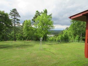 Great piece of property with Shoal Bay right out the back door. The 39.83 acres is totally fenced has a barn with concrete flooring plus RV storage shed. There is county water along with a well. New Pella windows through out the home along with a metal roof.Original hardwoods in most of the house4 bedrooms and 3 baths on the main level, fireplace, formal dining and central vac.