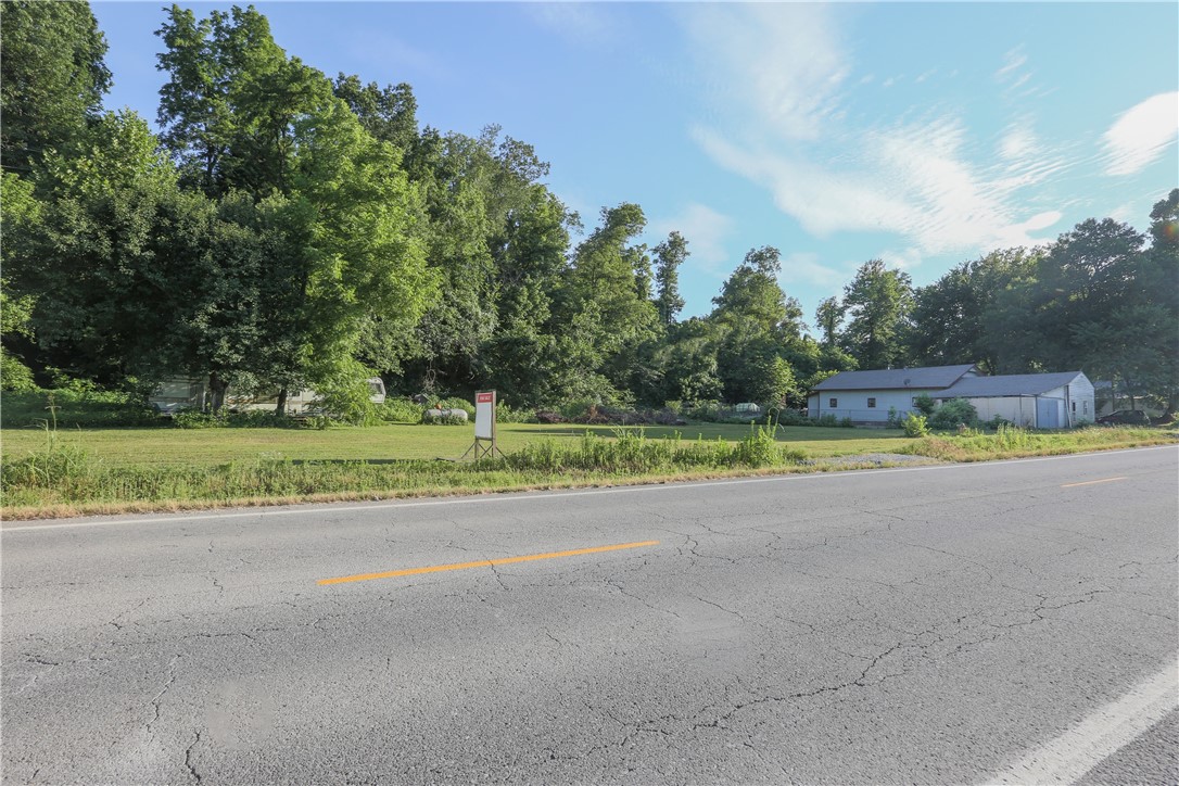 Investment Property. Potential for Commercial Development , Currently 12 small lots with Two septic systems, two water taps . Connections for a trailer or additional home. Electric, water across north end (front) House Currently Leased.