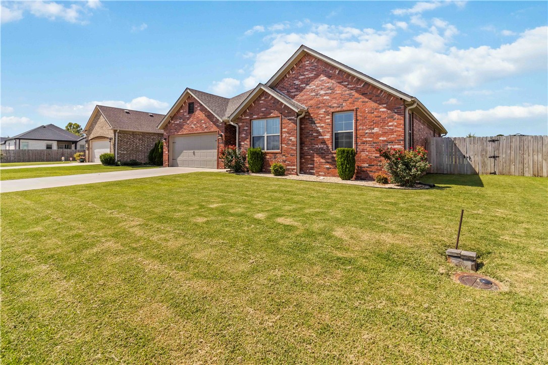 Welcome to this inviting 3-bedroom, 2-bath home built in 2016, designed with comfort and style in mind. The open layout creates a seamless flow between the living room, dining, and kitchen areasāperfect for entertaining or relaxing by the cozy gas-log fireplace. The kitchen features granite counters, a large bar seating area, and an abundance of storage with a spacious pantry. The primary suite is a true retreat with backyard views, dual vanities, an oversized walk-in shower, and a massive closet. Two additional bedrooms and a full bath provide plenty of space for family or guests. Step outside to the thoughtfully designed back patioāideal for gatherings, grilling, or simply enjoying the outdoors. Located near C.L. āCharlieā & Willie Park, with quick access to Fayetteville and I-49.