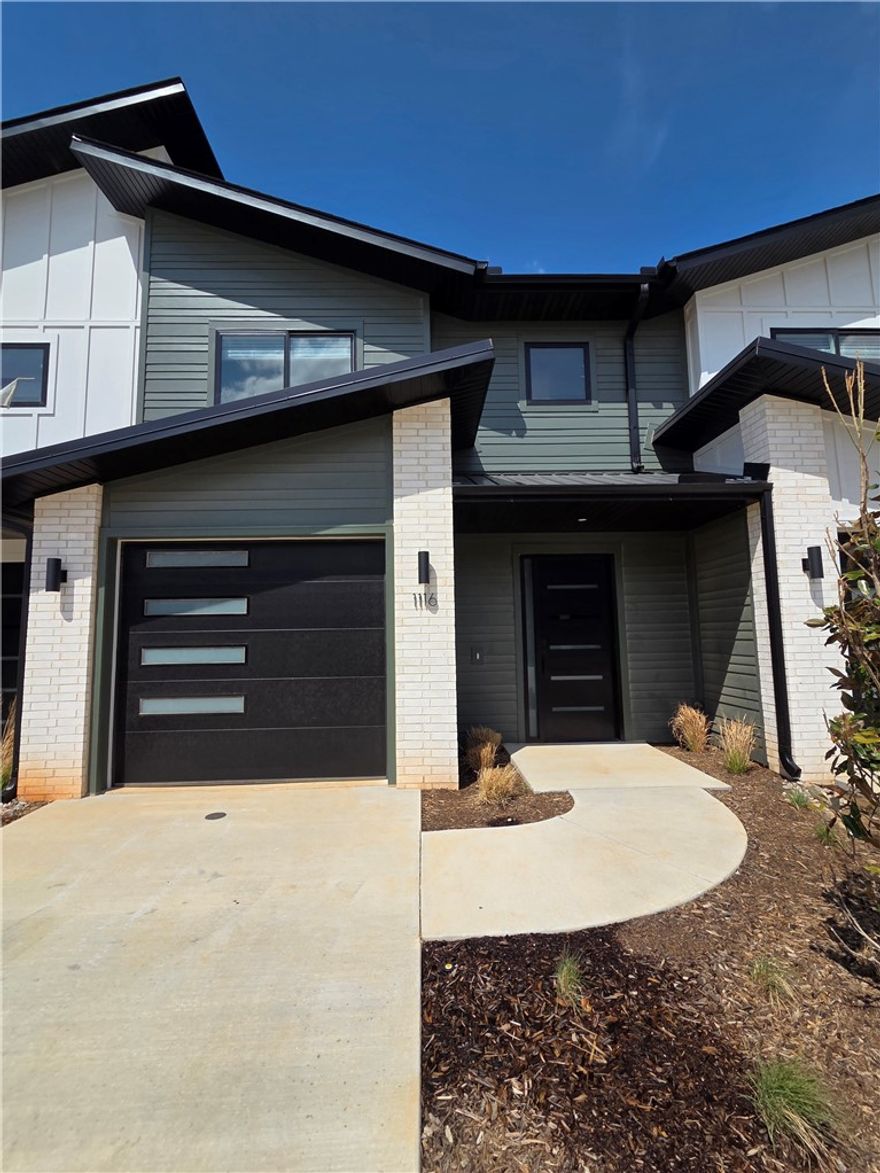 Welcome to Parkside of Lowell — where contemporary design meets vibrant community living. These thoughtfully crafted luxury townhomes boast spacious open floor plans, finishes include quartz countertops, stainless steel appliances, & elegant oak-style vinyl flooring throughout. With energy-efficient, all-electric systems, comfort meets cost savings year-round. This is the Lucy plan-with "Medium (Wood Tone)" interior finishes. Perfectly positioned along the Razorback Greenway & surrounding the coming soon - Kathleen Johnson Park — future home of the exciting NWA Space and Science Center — Parkside offers unmatched access to outdoor living & convenience. Residents enjoy resort-style
amenities, including a clubhouse, gym, pool, pickleball, basketball and more. Call to schedule your tour
today! Not all photos are of exact unit