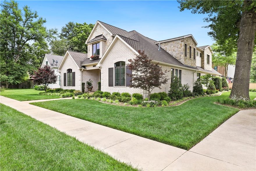 STUNNING, CUSTOM BUILT DOWNTOWN BENTONVILLE HOME, just a few blocks from the City Center Square! This practically NEW, 4B/3.5Bth, immaculately kept home, boasts a Chef's kitchen w/ GE Monogram appliances, artfully crafted walnut inlayed breakfast table/island, and ample pantry space. Beautifully sourced, antique doors and custom draperies shine on every window. The wide plank hardwoods ground the home with their warm, inviting tone. A true master retreat, all leading to a spa like master bath, glassed in shower, soaking tub, and large, well organized closet. 2nd level features a massive bonus space/bdrm w/ a built in desk. Wonderful TV/landing area upstairs w/ a 2nd laundry, and rooms w private ensuites. Outdoor living/entertaining is a breeze w/ integrated heaters, full outdoor kitchen and flagstone pavers. Perched on a fenced, corner lot, w/ an expansive 3 car garage, w/ epoxy flooring. This is your chance to live and walk to the some of the most renowned trails, museums and restaurants in the country!