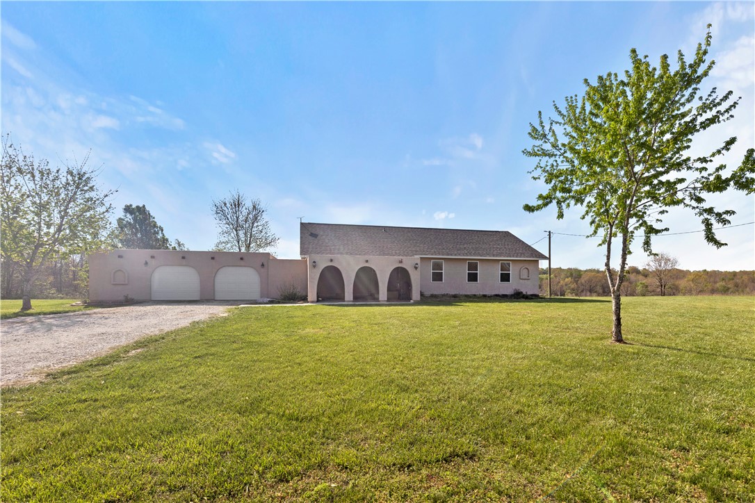 Enjoy peaceful country living on just over 10 acres with this well-maintained 2-bedroom, 2-bath home, built in 2013. With 1,540 sq ft of thoughtfully designed living space, the home features a bright, open layout perfect for comfortable living and taking in stunning sunrise and sunset views.
Outside is where this property truly shines. Raised garden beds are ready for planting, and outbuildings provide convenient storage for tools and equipment, easily add in a chicken coop, offering a great start for anyone interested in homesteading. The spacious yard and open land offer plenty of room for outdoor entertaining, with space for everything from cookouts to quiet evenings under the stars. Take it up a notch with the fire ring ready to bring on those outdoor memories.
Conveniently located just minutes from Highways 65, 62, and 412, you get the best of both worlds—peaceful, private acreage with easy access to nearby towns and amenities.