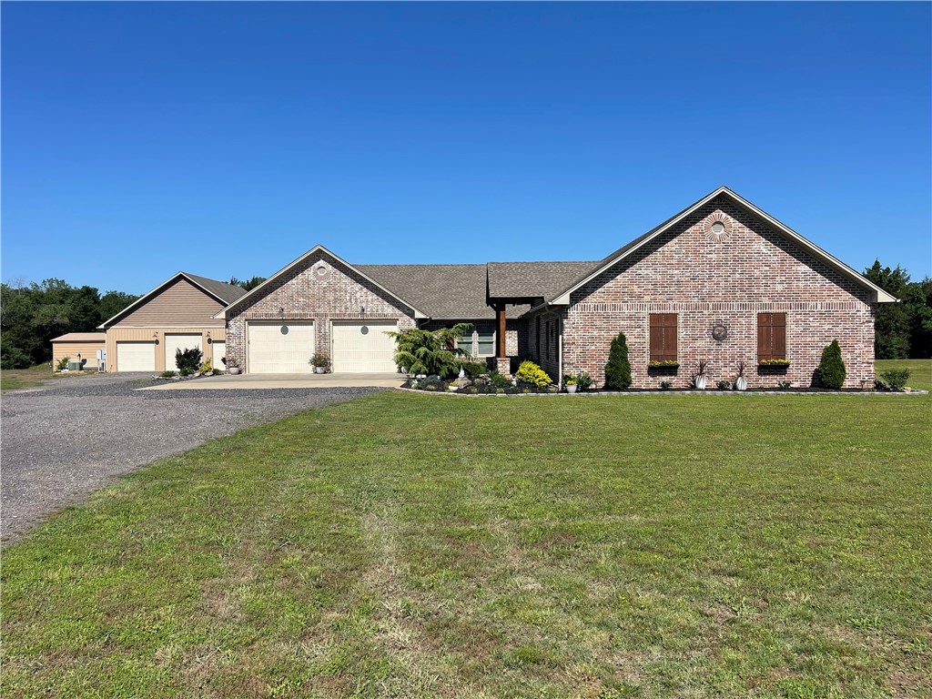 This completely custom estate sits on 41 acres of lush, usable pasture—perfect for cattle grazing. Enjoy two ponds, one with a fountain as a backyard focal point, plus a 200-yard shooting range. The 2,400 sq ft home features 3 beds, 2.5 baths, LVP flooring, cathedral ceilings, propane fireplace and a chef’s kitchen with a massive island, custom pull-out cabinetry, a coffee bar with built-in water tap, and a 36” propane range with electric oven. The primary suite offers a walk-in closet with built-in dressers and a luxurious custom shower. Extras include a spacious laundry room, oversized garage with storm shelter, and storage galore. The 2,000 sq ft climate controlled shop has a finished office complete with a half bath. Relax in the saltwater pool with a waterfall and slide, or entertain at the full outdoor kitchen. Whole-home water filtration, spray foam insulation, covered area behind the shop with a complete RV setup and countless custom touches make this one-of-a-kind property unforgettable.