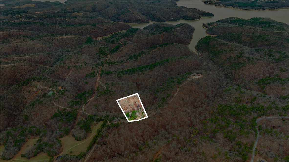 Discover the perfect canvas for your dream home with this stunning 5-acre tract in Emerald Bay subdivision. Boasting breathtaking views and endless potential, this property offers a serene retreat near the lake. While well water and septic are needed, electricity is already on-site, making your building process more convenient.
Located just minutes from the historic War Eagle Mill and a short drive to downtown Rogers, youāll enjoy the perfect balance of peaceful living and easy access to amenities. Whether youāre envisioning a custom home or a weekend getaway, this property provides the ideal setting to bring your vision to life. Donāt miss this rare opportunity to own a slice of Emerald Bay!