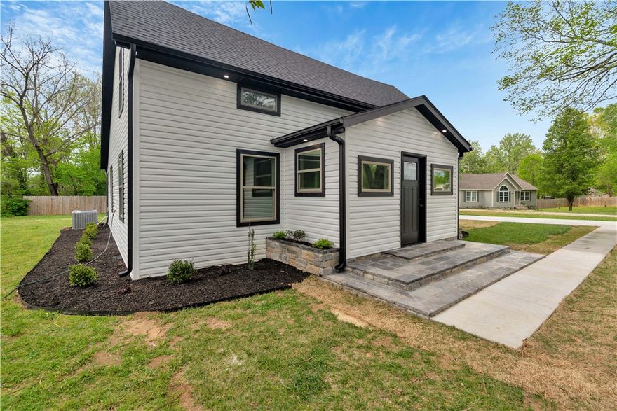 Completely Remodeled Home in South Fayetteville – Move-In Ready! Fully remodeled home located at 5808 S. Cardwell Rd featuring quality updates throughout. The kitchen offers granite countertops, island with coffee bar, stainless steel appliances, gas range, and under-cabinet lighting. Functional layout includes two upstairs bedrooms, each with private bathrooms and walk-in closets. The downstairs master suite features a walk-in closet, dual vanities, and updated tile finishes. Additional upgrades include luxury flooring, LED lighting, lighted mirrors, and remote-controlled ceiling fans. Major improvements include new HVAC system, roof, electrical wiring, plumbing lines, and windows. Exterior features include deck lighting for added ambiance. Conveniently located with modern finishes and major system updates—this home is move-in ready.