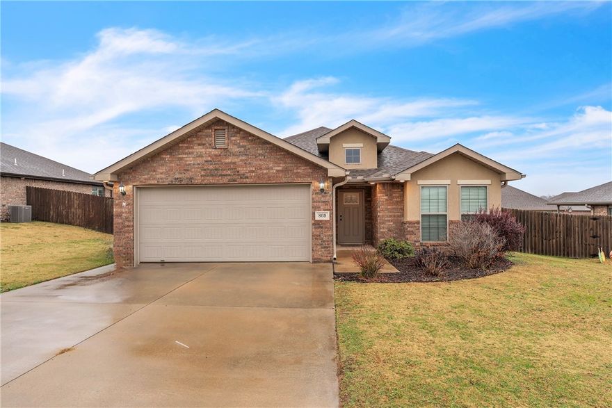 Welcome home to 808 NW 63rd Avenue — a well-kept 3-bedroom, 2-bath home in Bentonville’s Silver Meadows community. Built in 2018, this home features an inviting open layout with a light-filled living room that connects to a modern kitchen complete with granite countertops, a large island, and generous cabinet space. It’s a great setup for entertaining or simply enjoying everyday life. The primary suite offers two separate closets and a comfortable ensuite bath, while the additional bedrooms provide the flexibility you need for guests, kids, or a home office. Outside, the fenced backyard includes a patio perfect for relaxing and a delightful she-shed — ideal for crafting, storage, or your own quiet escape. With a two-car garage, a level lot, and quick access to Bentonville schools, parks, shopping, and local amenities, this home blends convenience with modern comfort. Move-in ready and easy to love, it’s a fantastic find in Silver Meadows.
