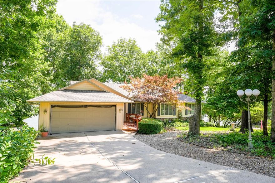 Welcome to your dream home on Loch Lomond!This extraordinary property offers over 300 feet of pristine lakefront, providing some of the most spectacular and panoramic views available.Gently sloping from the home to the water’s edge, the setting is as inviting as it is scenic.Enjoy not 1, but 2 covered boat docks.The home has been thoughtfully remodeled, freshly painted, and updated throughout—including a fantastic new 4th bedroom on the lower level, featuring double doors that open to the outdoors.The cathedral-ceiling living room is anchored by a striking stone fireplace, while the sunroom offers breathtaking views of the lake—perfect for morning coffee or evening relaxation.With a newer HVAC system and a roof replaced in 2019, the essentials are already taken care of. In addition to the attached two-car garage, you’ll find an extra garage for all your storage needs.Nestled on one of Bella Vista’s most prestigious cul-de-sacs, this home truly has it all. Come home to Loch Lomond, your lakefront lifestyle awaits!