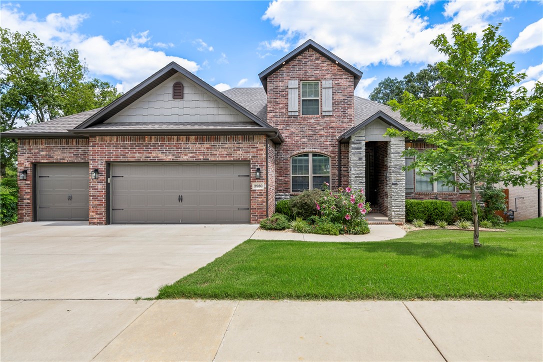 This better-than-new east Fayetteville home features 5 bed, 3 baths, 3-car garage. Only 4 minutes to shopping/dining, 8 minutes to Fayetteville Mall & 11 minutes to the U of A - the location is fantastic!. The main floor includes an expansive primary bedroom suite as well as three secondary bedrooms. The second floor is dedicated to a large additional bedroom ensuite, perfect for mother-in-law or college student. This home features soft-close cabinets throughout, w/quartz countertops in the kitchen & granite in the baths. Wood floors run through main areas of home including primary bedroom & stairs, while secondary bedrooms are carpeted. Kick off your shoes at the large bench in laundry room & walk directly into attached primary suite closet. Outside you'll find a large entertainment space that includes three decks & a 6-person hot tub w/cedar pergola! Custom horizontal privacy fencing encloses yard w/lovely mature trees - sit on your deck in the evening & watch deer graze beyond fence. No HOA!