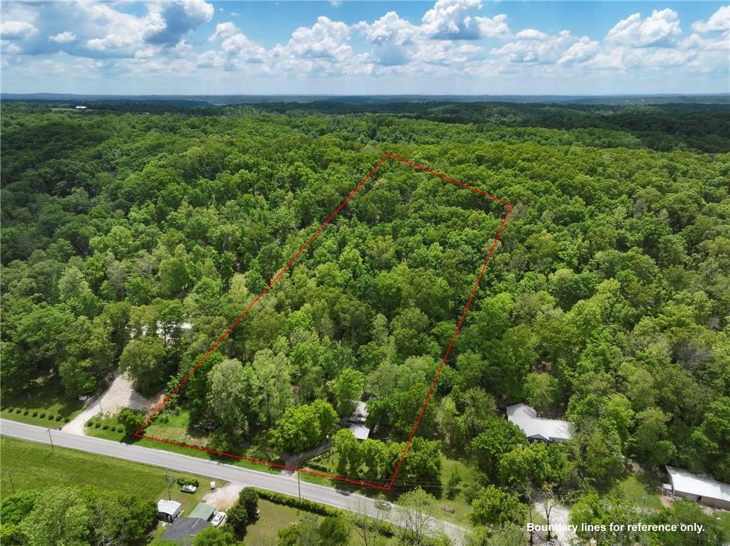 Discover the potential of this 5-acre parcel just outside of town near the scenic Beaver Lake area. This partially wooded property offers a peaceful, natural setting with a gentle slope—ideal for building, recreation, or simply enjoying the outdoors. A home is already situated on the property, offering a great starting point for renovation. The structure will require a new roof and extensive foundation repairs.
Whether you're seeking a private retreat, an investment project, or land to build on, this property combines opportunity and location in one attractive package.