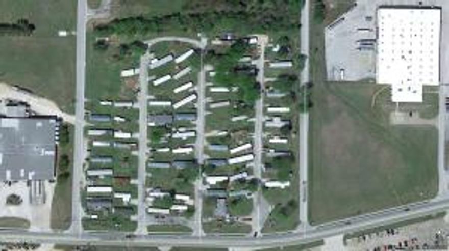 Established Manufactured Home park centrally located. Paved streets and city sewer. This property is located in an Opportunity Zone. Financials available to qualified buyer, 77 lots total