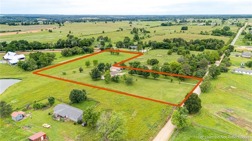 This beautiful 5 acres with fruit trees, cross fence, shop building with a manufactured home on permanent foundation, on 4.99 acres. Home has 6" exterior walls for lower energy bills. Plenty of room to build more homes or have a horse, cow, etc. In RD loan mapped area. This is also listed as residential home for sale MLS#1277015
