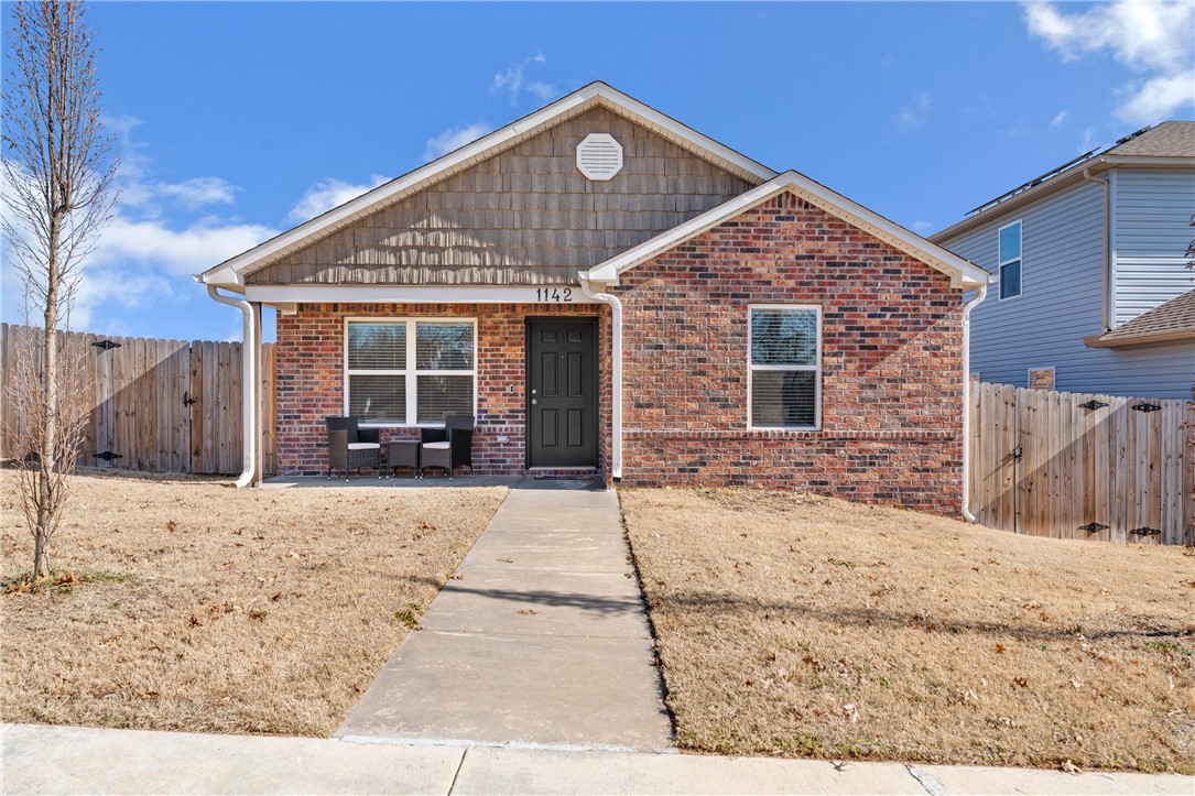 Discover this charming 3-bedroom, 2-bathroom home in Fayetteville, offering simplicity and practicality. The quaint eat-in kitchen features plenty of natural light, creating a cozy space for meals and everyday living. Step outside to the spacious backyard, larger than most thanks to its corner lotāperfect for entertaining, gardening, etc. The fully bricked exterior adds durability and timeless appeal, while gutters and installed blinds provide added convenience and privacy. The prime location near the University of Arkansas gives easy access to campus and top attractions, including the Fayetteville Square, the Razorback Greenway, and Walker Park. Plus, enjoy the convenience of nearby grocery stores, restaurants, and more. This home balances simplicity, affordability, and locationādon't miss it!