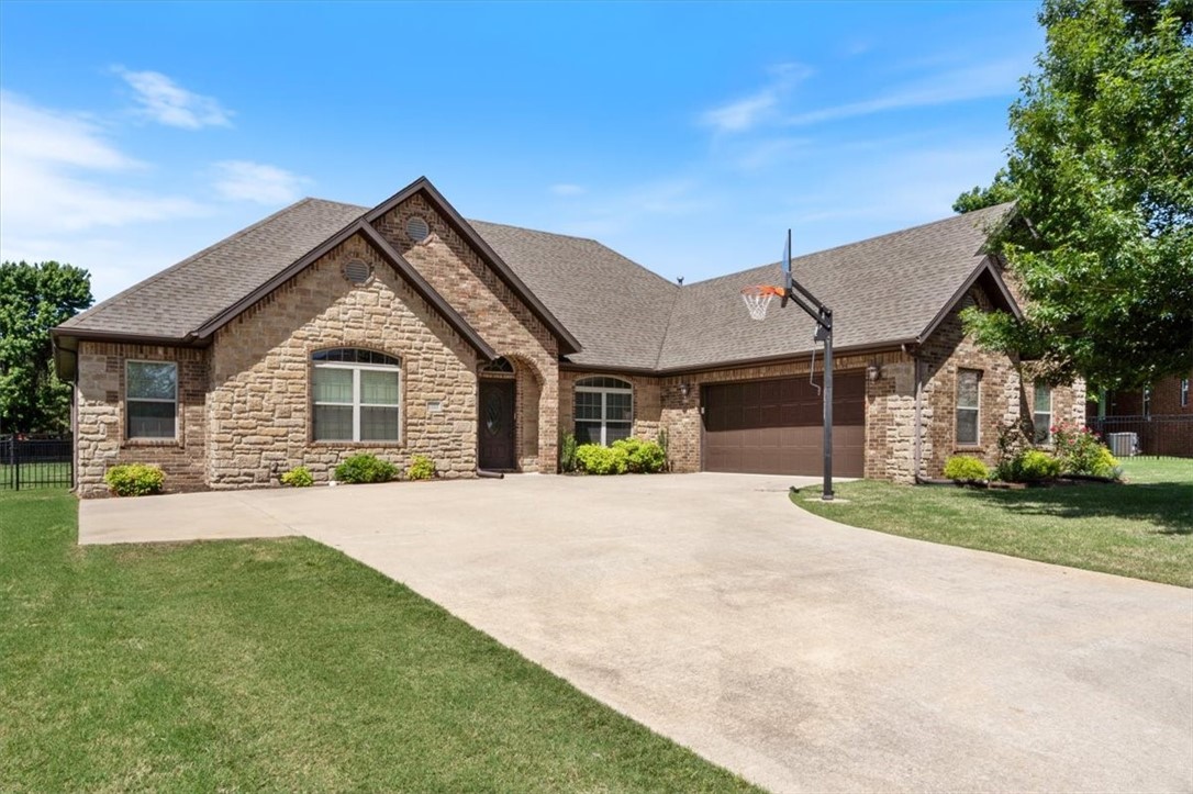 Welcome to this inviting, well-maintained brick home with 4 bedrooms and 2 bathrooms on over a third of an acre. The spacious kitchen features granite countertops, double ovens, gas cooktop, pantry, and an eat-in area, complemented by a formal dining room for entertaining. Serene colors flow into the spacious living area with a cozy gas fireplace and into the split floor plan providing which provides added privacy. The generous primary suite boasts a tray ceiling, double vanity, large walk-in closet, jetted tub, and separate tiled shower. Step outside to an expansive yard enclosed by an iron fence—ideal for pets or little ones and a large patio for outdoor living. Located in an inviting community, this custom home offers comfort, space, and versatility for any lifestyle.