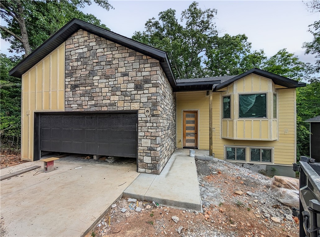 Welcome To Your Next Home! This One Has Everything! 4 Bedrooms, 3 Bathrooms, Connected To Sewer, Bentonville Schools, MTB Trails In Your Backyard! The Perfect House, The Perfect Location. The Love Is Spread Over 2 Levels, With The Main Level Offering The Primary Living Area w/ Vaulted Ceiling, Kitchen/Dining, Primary Suite w/ Full Bath, Half Bath. The Lower Level Offers A Secondary Living Area, 3 Add'l Secondary Beds + Full Guest Bath, Laundry/Utility. Interior Will Be Loaded With Amenities - Custom Cabinets, 3cm Granite, Tile Backsplash, UC Lighting, Full Custom Tile Shower In Primary, And So Much More. Contract Early To Make Selections To Suit Your Style. Reach Out For Full Specs.