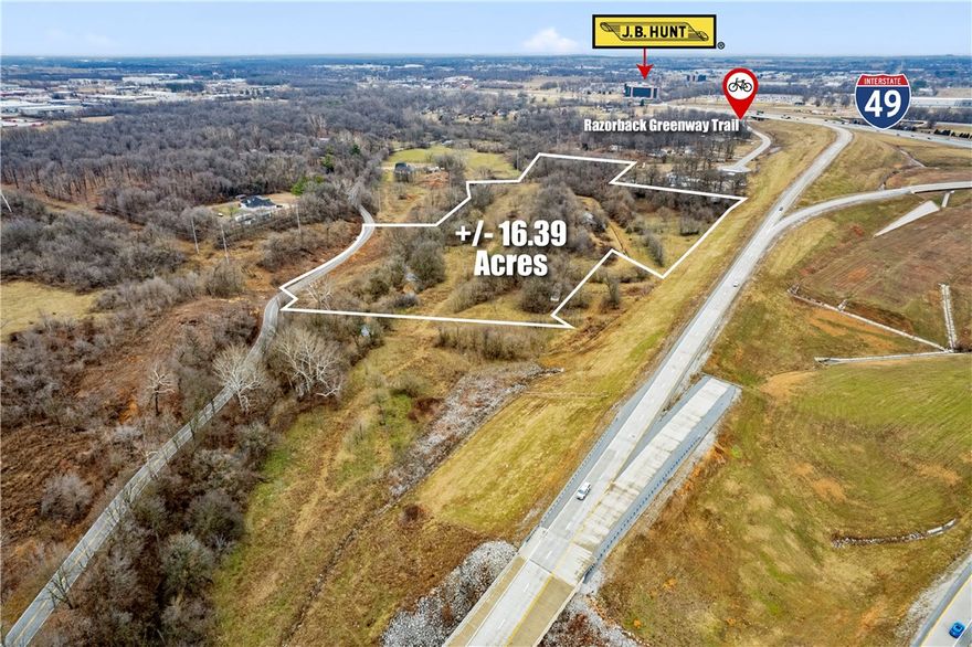 Potential for multi-family development, this +/- 16.4 acre site has a sewer line running along the south side of Puppy Creek. Potential access into the site would need to come from the south off of Burrell Pl (No easements currently granted). Puppy Creek might work for detention purposes but needs to be explored by prospective buyers, as does feasibility of all of the aforementioned. Currently Zoned R-2 Intermediate Neighborhood. Easy access to I-49 and close to the Razorback Greenway trail.