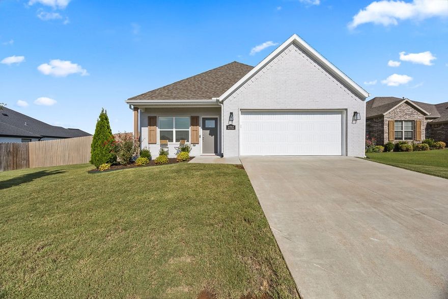 This one is special! Not your typical Riverwalk floor plan and lot size, this beautifully maintained home stands out with thoughtful upgrades, spacious layout, and a large .27ac lot.  Just minutes to downtown Fayetteville and the UofA Campus! Beautiful wood floors flow through the living room, kitchen, and main-level primary bedroom. Open concept kitchen features ceiling-height cabinetry, quartz countertops, large island, walk-in pantry, gas range, and farmhouse sink. The very spacious main-level primary suite offers an ensuite bathroom and 10x6 walk-in closet. Upstairs, enjoy a flexible bonus room/workout space plus two generously sized bedrooms and ample storage. Step outside to a beautifully landscaped backyard, complete with an extended patio for outdoor living.  Frigidaire French door refrigerator & GE washer, and dryer convey.  Truly move-in ready and better than new!