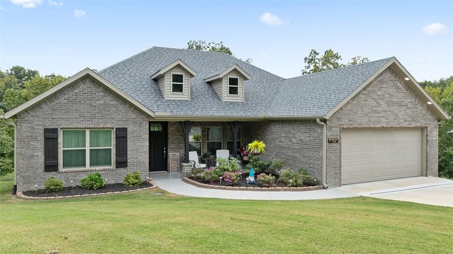 Built in 2022 with a focus on craftsmanship and design, this one level custom home blends refined finishes with everyday comfort. Tucked away on a quiet cul-de-sac, this meticulously maintained, turn-key home is just minutes from Branchwood Recreation, Loch Lomond Lake, Lake Pointe Marina, golf courses, dining, scenic hike and bike trails, and all the everyday amenities Bella Vista has to offer. Featuring an ideal split floorplan, the interior offers vaulted ceilings, recessed lighting, timeless ceramic tile flooring, and a statement brick fireplace. The eat-in kitchen includes quartz countertops, a large island, pantry, stainless steel appliances, and ample cabinet space. Brick exterior with professional landscaping, French drains, and an epoxy-coated garage floor, front porch and walkway, add both style and function. The fully fenced, tiered backyard offers space to relax or entertain, with a covered deck and TV mount for effortless outdoor living. Tour today and call it home!