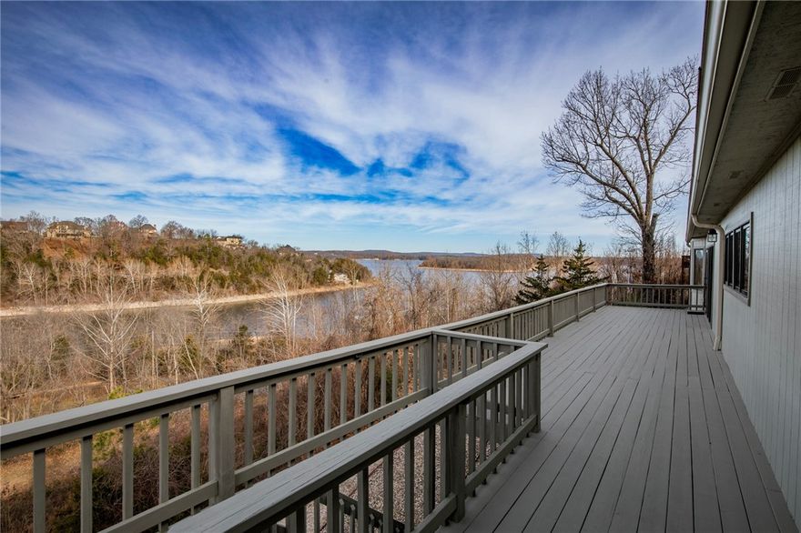 Wake up to beautiful scenic views of Beaver Lake! This home has been meticulously maintained, provides a functional and inviting layout that offers great entertaining space both indoors and out. The main level features a well appointed kitchen with amazing views, a large living room overlooking the lake, separate dining room, oversized utility room, half bath, and primary bedroom/bathroom. The finished basement offers 2 additional bedrooms, full bathroom, a game room/2nd living room with kitchenette, plus a space perfect for home office or exercise room. Walk-out access to the 2 story deck from either level. 36" doors throughout. Surrounded by the natural beauty of Northwest Arkansas, this property offers a peaceful setting just minutes from Downtown Rogers.