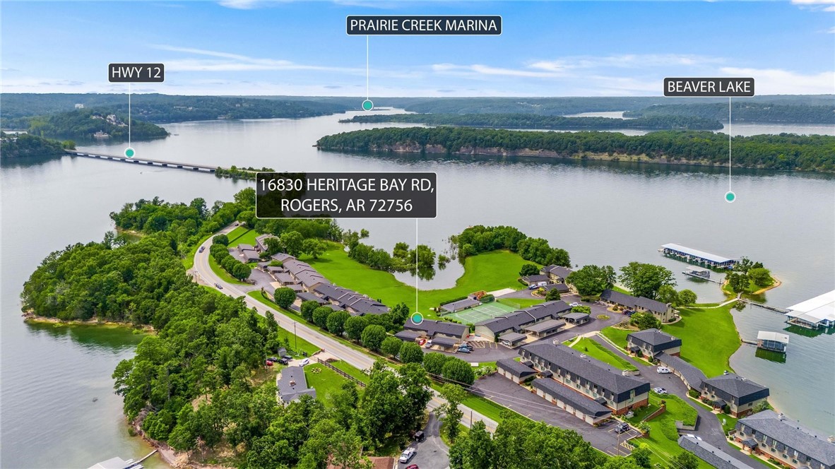 Elevate your lifestyle with this exceptional 2nd floor Beaver Lake Condo, showcasing stunning views of the water. Experience the best of maintenance-free living, complete with a clubhouse featuring a heated pool and tennis court ideal for pickleball enthusiasts. This remarkable condo offers a rare opportunity for lakeside ownership. Perfect for family gatherings or weekend getaways, this condo provides ample space for relaxation and entertainment. The expansive living room features a patio deck with panoramic views of the tennis court and lake. The thoughtfully designed split floorplan highlights a serene primary bedroom with picturesque lake views, accompanied by two generously sized bedrooms and an additional bathroom.