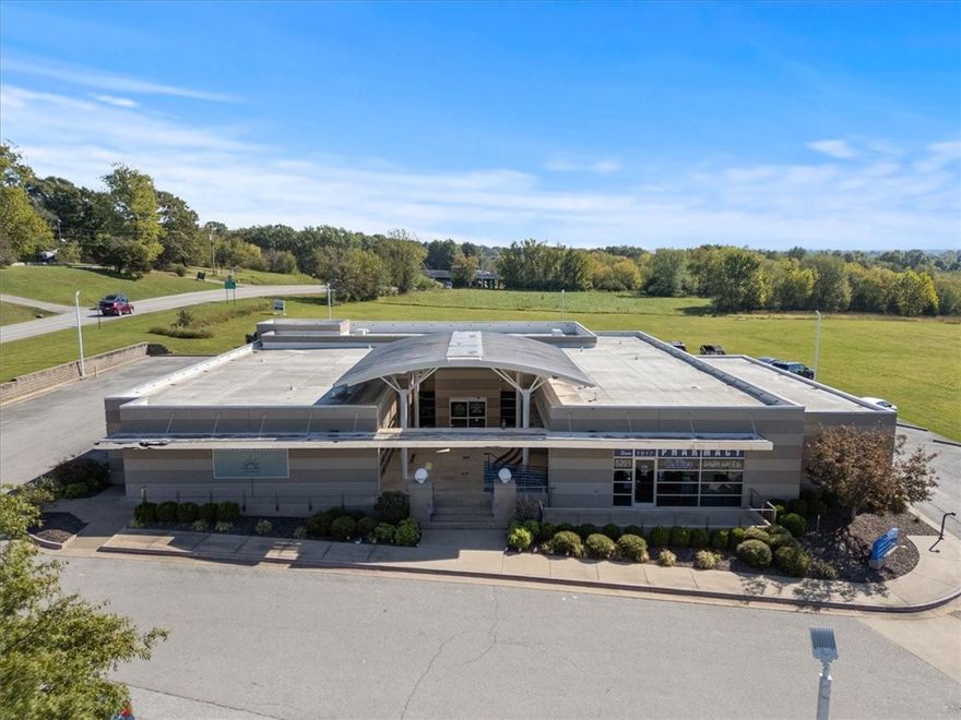 Prime Northwest Arkansas Commercial Opportunity! Featuring a substantial 9,634 sq ft building with multiple potential uses and desirable TC zoning, this site offers significant development or investment potential. This exceptional 1 +/- acre property boasts a strategic location right off Interstate 49, offering unparalleled access to the entire Northwest Arkansas region. Enjoy excellent visibility with approximately 220 feet of frontage on Willow Creek Drive and 230 feet on Johnson Mill Boulevard. Situated moments from Willow Creek Hospital, and offering arguably the best on and off interstate access along I-49, this is a truly premier location. See MLS 1282936, MLS 1309149, MLS 1326773