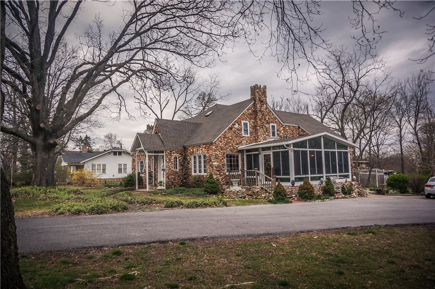 Beautiful Historic Tutor home in downtown Bentonville. Walk or bike to the square, Crystal Bridges, trails. Home used to be bed & breakfast. Sits on 4 lots/ 1.43 acres. 2 vacant lots are flat to develop or build on. 4 bedroom 3.1 baths, 3 living areas, 2 fireplaces w/wood burning incents, sunroom. One fireplace is made of crystal rocks. Wood floors very unique. Property has tons of potential or uses.