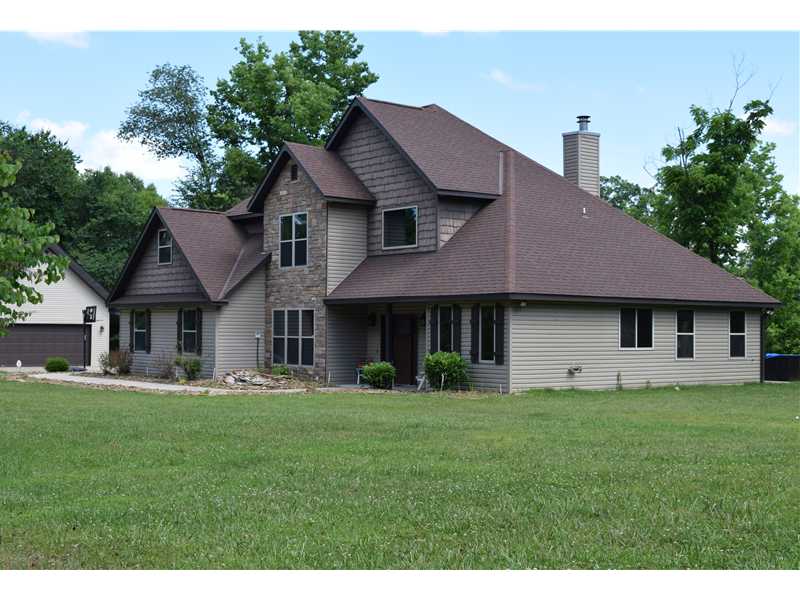 Great Family home on 5.36 acres w/year round lake view ,Boat Slip is available at additional $25,000. 2 living areas, 5 bedrooms 2 down 3 up + play room. Wonderful kitchen and dining area w/built in seating, covered and open patio areas, play house for the kids, on deep well good water,2x6 construction energy efficient. Ultra-air filter system. Large flat yard, bring the kids there is lots of room, Public Lake access is just 1.5 miles down the road. Boat Slip is available at additional $25,000. and is about a mile away. map attached