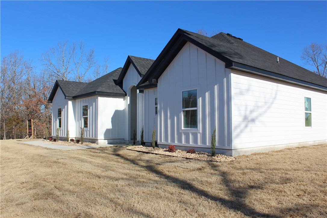 Have you been looking for a home to love but in all the wrong places? Hoping to find one with all the right spaces? Searching the market, looking for traces of what you're dreaming of? Don't know where it started or where it might end? Now you've found this gorgeous home near Beaver Lake then discover it's on 4+ acres, maybe room to build a shop, the search is over! Nearly complete, with an open main living & 4 beds & 2 baths, custom kitchen with a beautiful island, great for hosting or family gatherings. The main bedroom is situated off of the living room, ensuite bathroom with a soaking tub, spacious walk-in shower, 2 walk-in closets & a double sinks on a large vanity. Down the hallway towards the front of the home you'll find the other 3 bedrooms with a shared bathroom in the hallway. This gem is located near Beaver Lake & just down from Hobbs State park. A great location for any outdoors enthusiast who wants to connect with nature, yet not far to the developing downtown of Rogers. See the beauty for yourself!